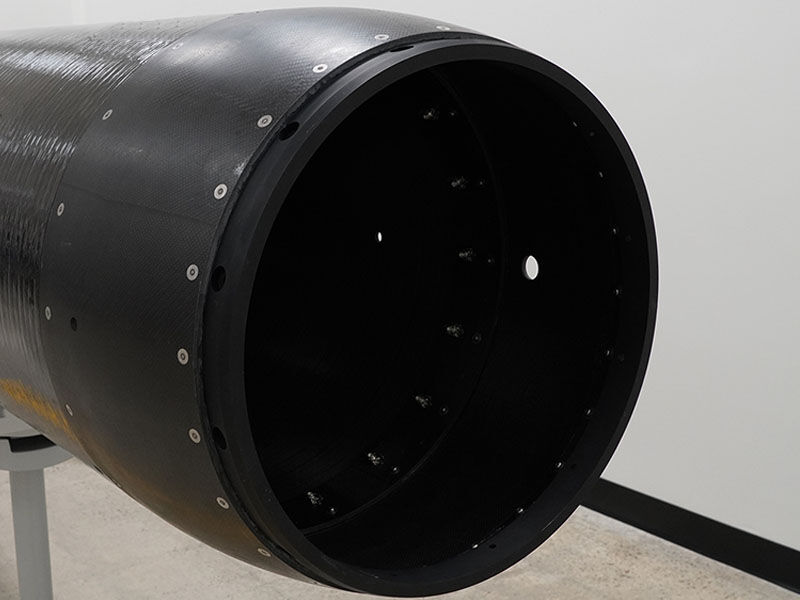 Filament wound carbon fiber fuselage for a defense-related unmanned system.